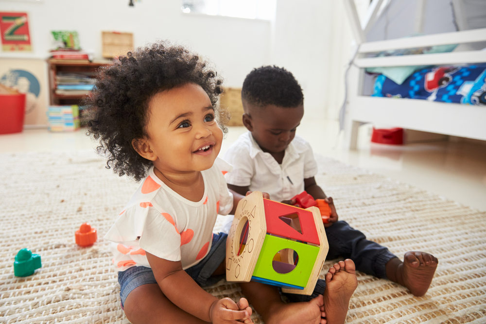 baby-boy-girl-playing-toys-playroo